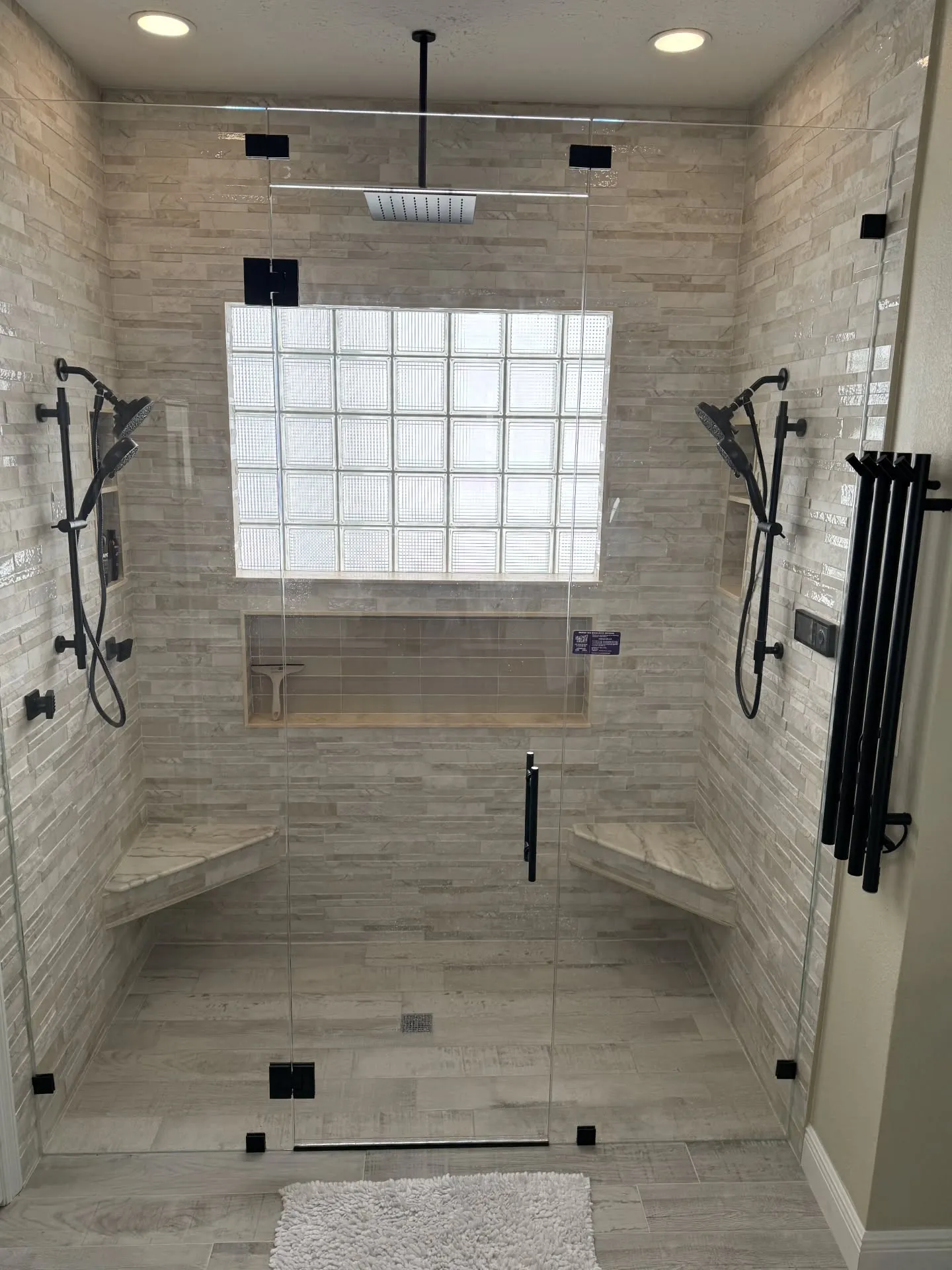 Spa-style walk-in shower remodel with travertine tile